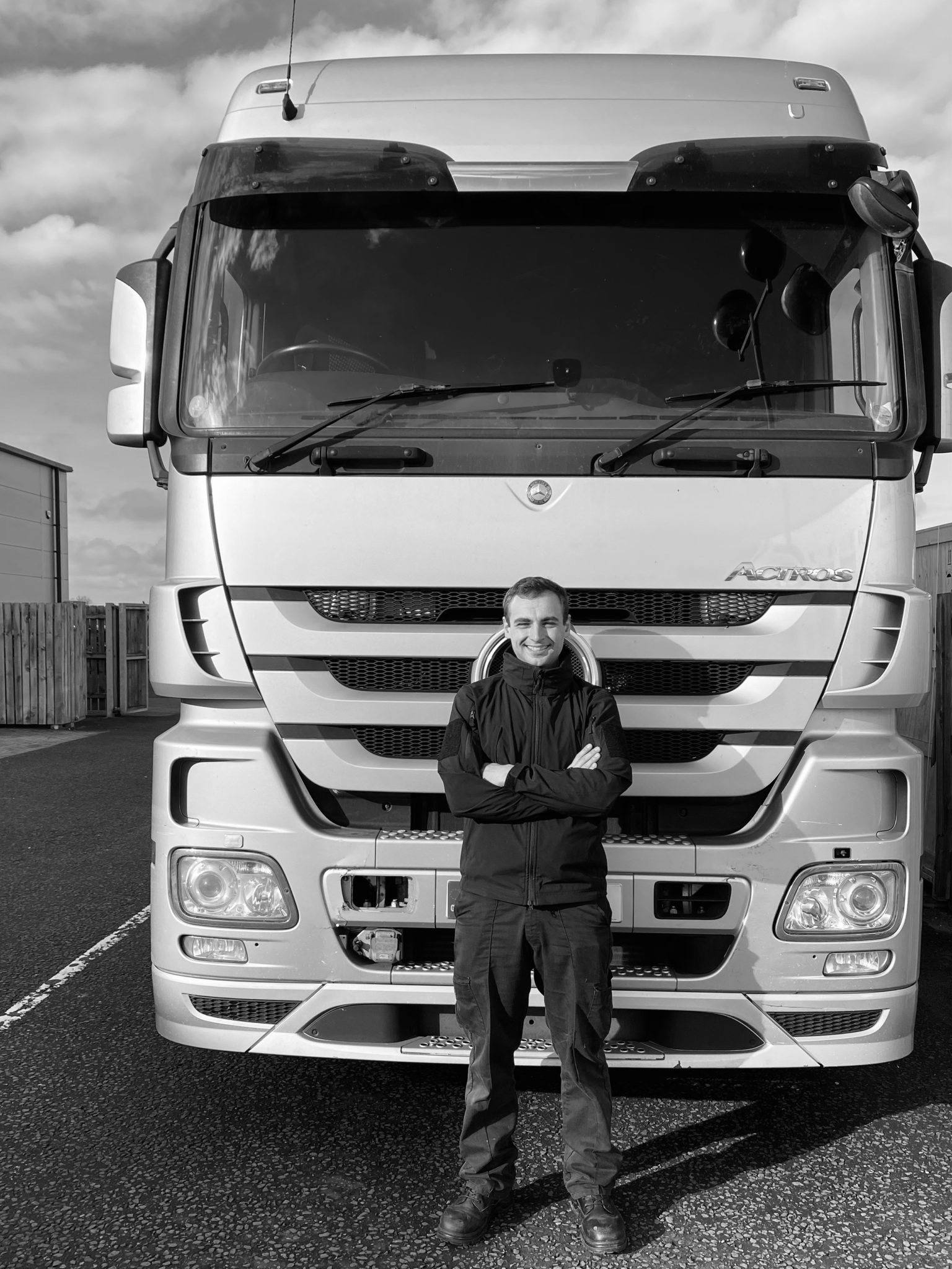 Jack standing in front of a lorry.