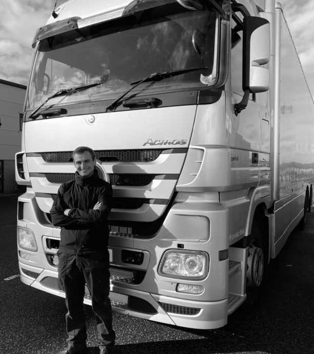 Jack standing in front of a lorry.